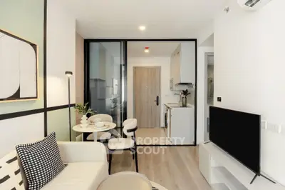Modern living room with sleek design and open kitchen layout