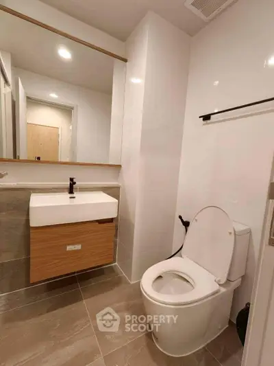 Modern bathroom with sleek fixtures and elegant tile flooring