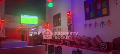 Vibrant living room with colorful decor and ambient lighting, perfect for entertainment and relaxation.