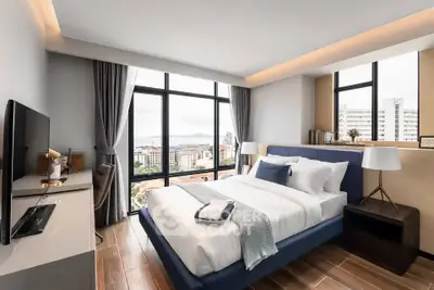Luxurious bedroom with stunning city view and modern decor