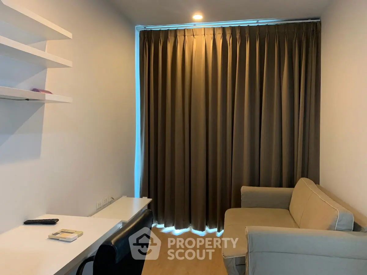 Cozy study room with modern desk and comfortable seating, ideal for productivity and relaxation.