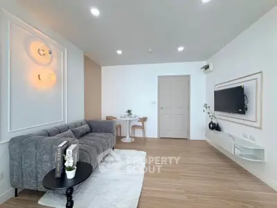 Modern living room with stylish decor and cozy seating area, perfect for relaxation and entertainment.