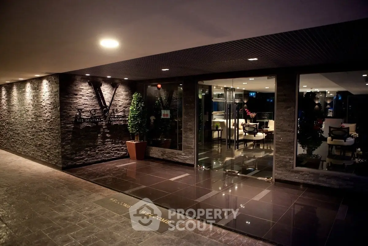 Luxurious building entrance with modern design and elegant lighting