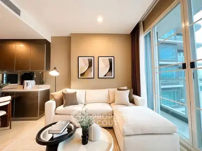 Modern living room with elegant decor and large windows offering natural light and city views.