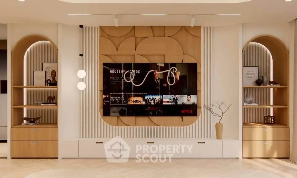 Modern living room with stylish wooden shelves and mounted TV, perfect for entertainment and relaxation.