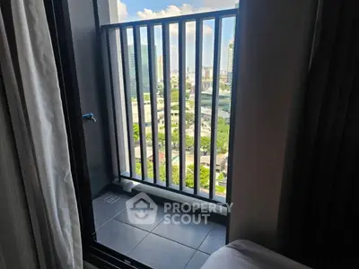 Charming city view from a cozy balcony, perfect for relaxation and enjoying urban landscapes.