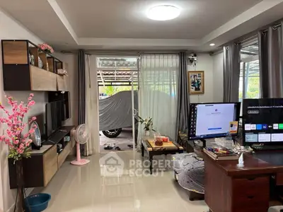 Spacious living room with modern decor and large windows offering natural light.