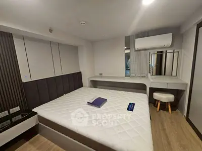 Modern bedroom with stylish decor and comfortable bed in a contemporary apartment.