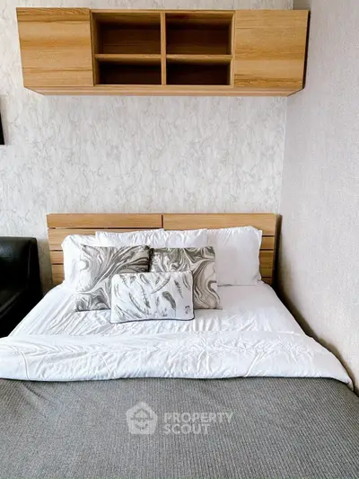 Cozy bedroom with stylish bedding and wooden storage shelves