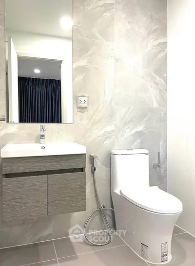 Modern bathroom with sleek fixtures and elegant marble tiles