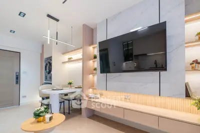 Modern living room with sleek TV setup and stylish dining area