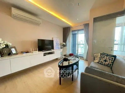 Modern living room with sleek design, featuring a wall-mounted TV, stylish furniture, and large windows with city views.