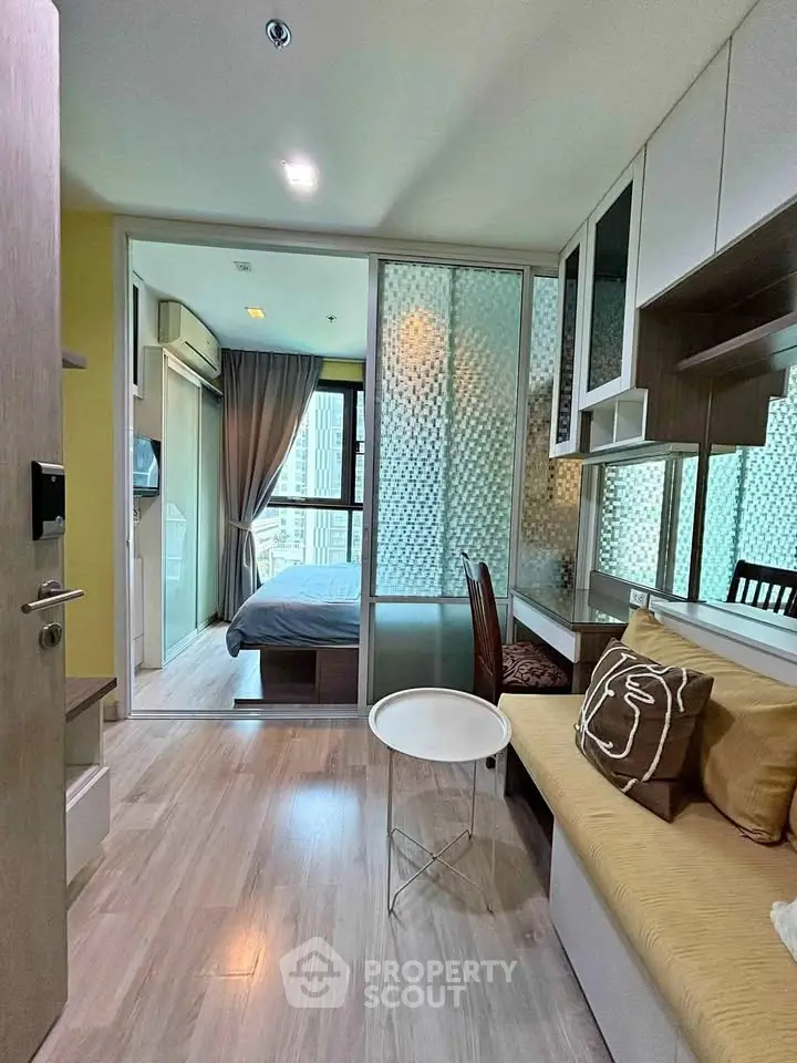 Modern compact apartment with cozy living area and stylish bedroom