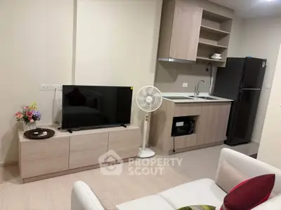 Modern living room with sleek kitchen and stylish decor