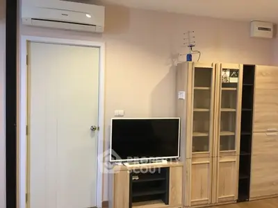 Modern living room with air conditioning and wooden furniture