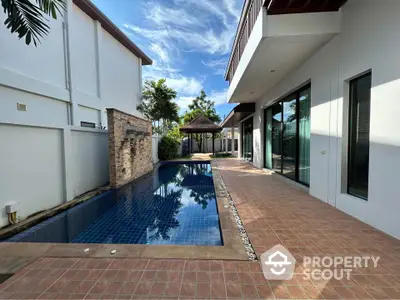 Luxurious villa with private pool and spacious patio in tropical setting