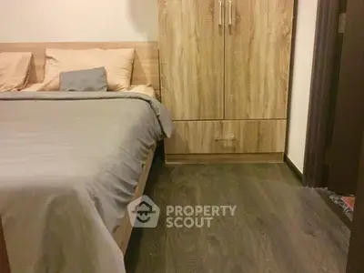 Cozy bedroom with wooden flooring and modern wardrobe design