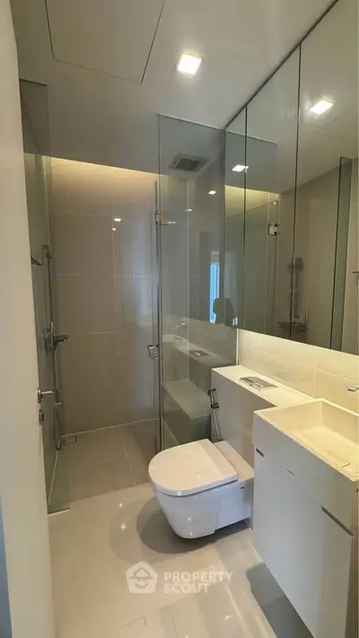 Modern bathroom with glass shower and sleek fixtures