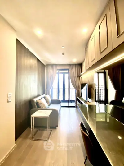 Modern living room with sleek design, large windows, and stylish furniture in a contemporary apartment.