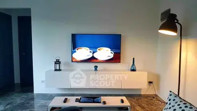 Modern living room with wall-mounted TV and stylish decor