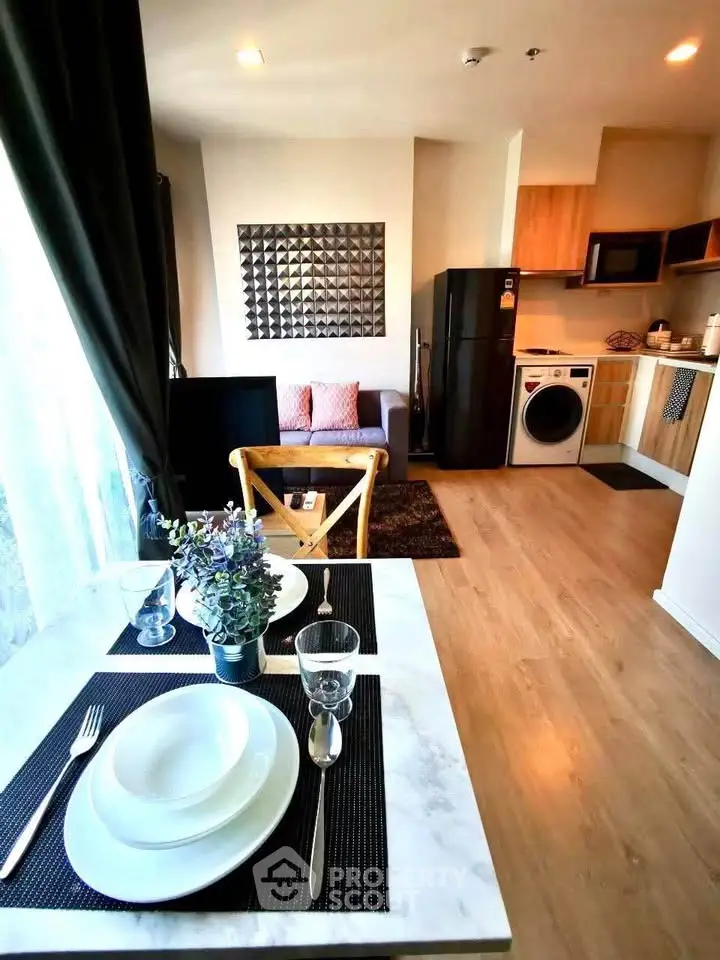 Modern open-layout apartment with stylish kitchen and cozy living area, perfect for urban living.