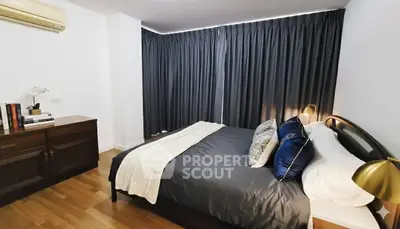 Elegant bedroom with modern decor and cozy ambiance, featuring stylish furniture and soft lighting.