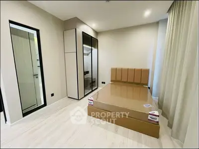 Modern bedroom with sleek wardrobe and minimalist design