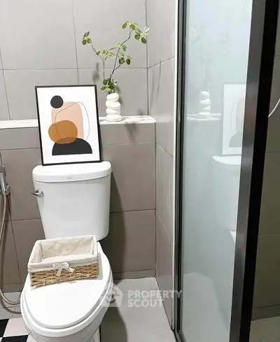 Modern bathroom with abstract art and sleek shower design