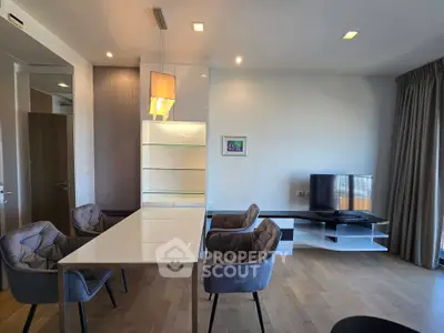 Modern living room with elegant dining area and stylish furniture