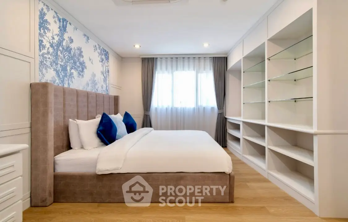 Elegant bedroom with stylish decor and ample storage space