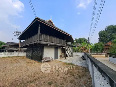 Charming traditional wooden house with elevated design and spacious outdoor area.