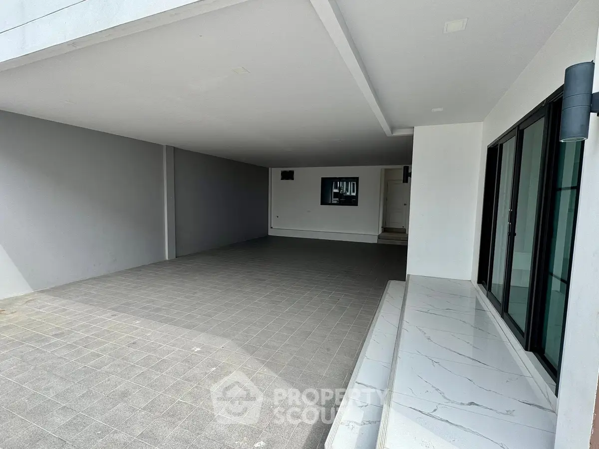 Spacious modern garage with sleek design and ample parking space.