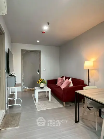 Modern living room with red sofa and stylish decor