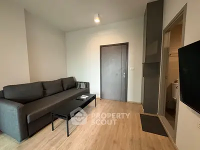 Modern living room with sleek gray sofa and minimalist decor