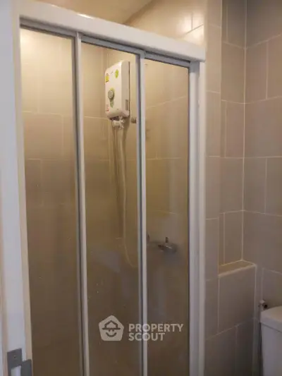 Modern bathroom with enclosed shower and water heater