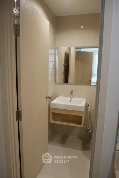 Modern minimalist bathroom with sleek fixtures and neutral tones