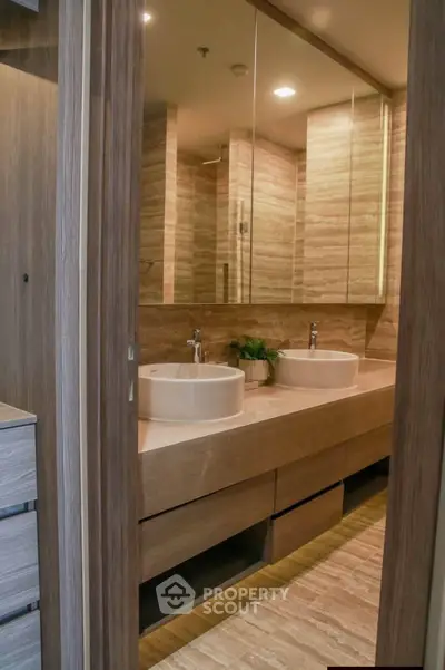 Luxurious modern bathroom with dual sinks and elegant wood finishes