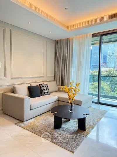 Elegant living room with modern sofa, stylish decor, and large window offering cityscape views.