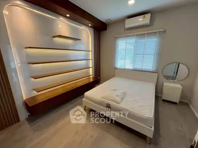 Modern bedroom with stylish shelving and natural light