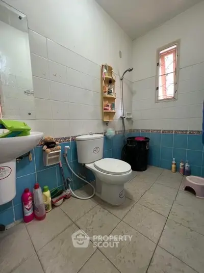 Cozy bathroom with modern fixtures and colorful tiles, perfect for a refreshing start to your day.