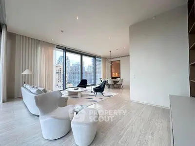 Luxurious modern living room with stunning city views and elegant furnishings.