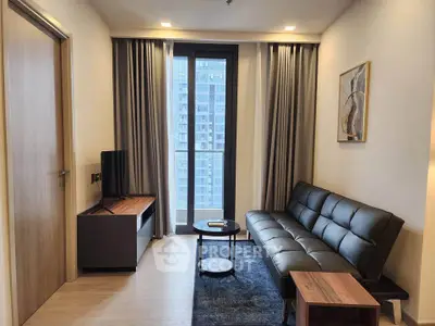 Modern living room with sleek furniture and city view, perfect for urban living.