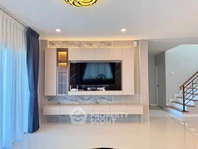Modern living room with stylish TV unit and elegant decor
