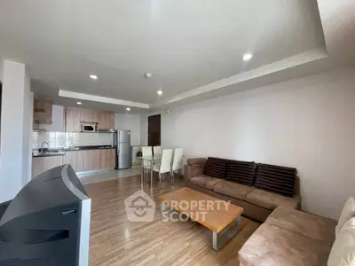 Spacious modern living room with open kitchen and stylish furniture