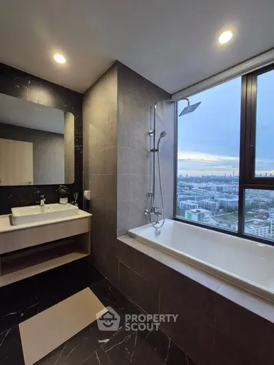 Luxurious bathroom with city view, featuring modern fixtures and elegant design.