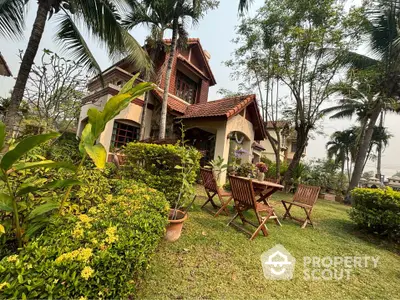 Charming villa with lush garden and outdoor seating, showcasing elegant architecture and tranquil surroundings for a serene living experience.