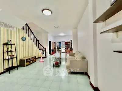 Spacious living room with modern decor and open layout, perfect for family gatherings.