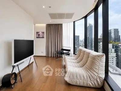 Modern living room with panoramic city views, stylish furniture, and floor-to-ceiling windows in a high-rise apartment.