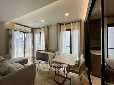 Spacious modern living room with elegant dining area and natural light