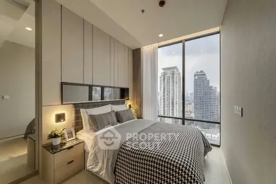 Luxurious bedroom with city view in modern high-rise apartment